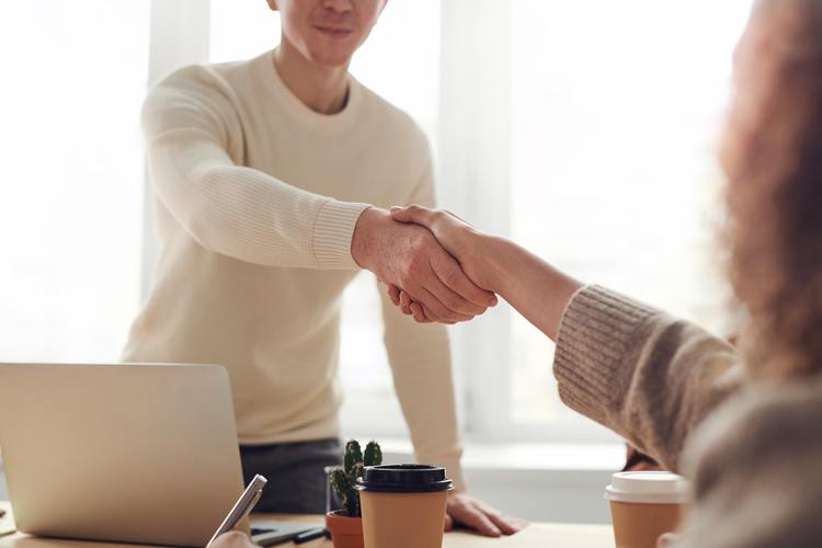 Candidate shaking hands with employer